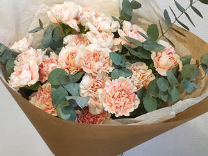 Delicate bouquet of cream dianthus and eucalyptus.