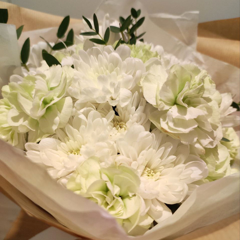 Delicate bouquet with white chrysanthemums.