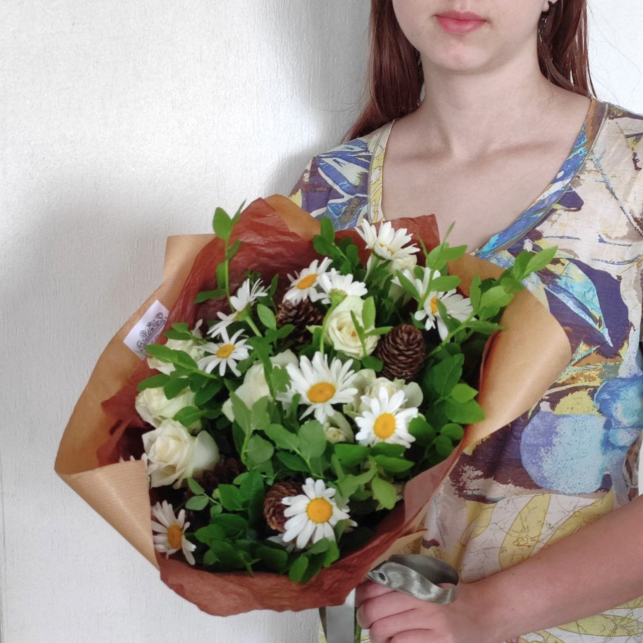 Summer forest bouquet with daisies, white mini roses and cones