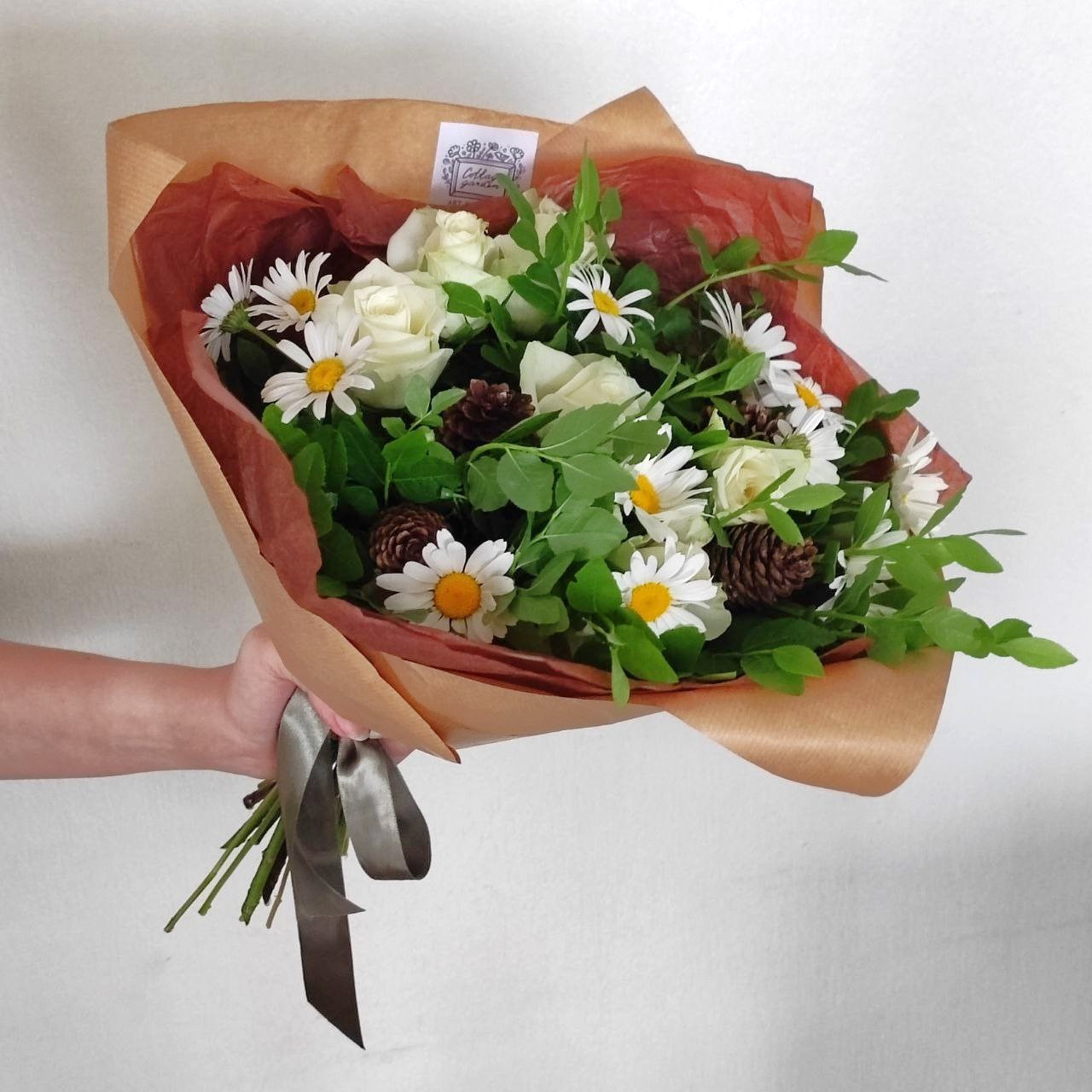 Summer forest bouquet with daisies, white mini roses and cones