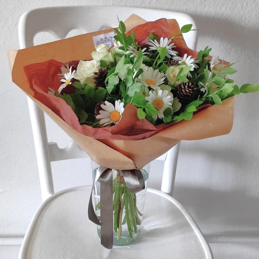 Summer forest bouquet with daisies, white mini roses and cones